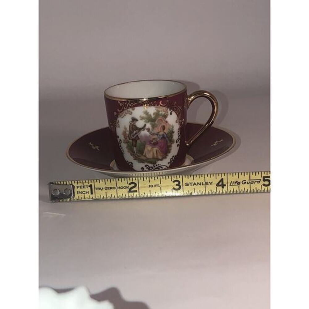 Limoges Porcelain demitasse cup & saucer Burgandy Red & gold white Made France